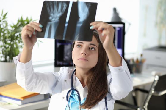 Doctor looking at x-ray scans